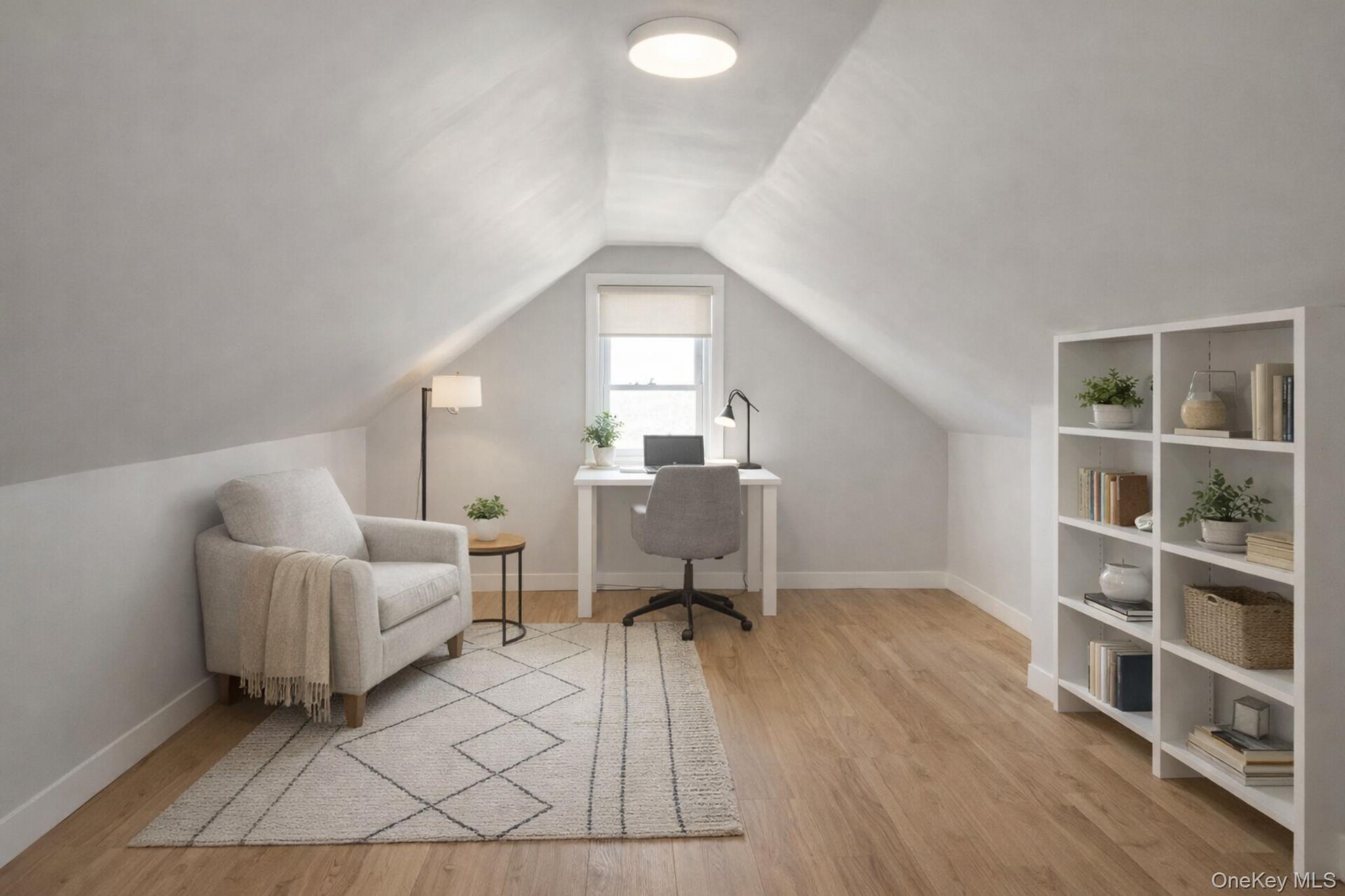 2146 Albany Post Road Montrose, NY 10548 - Photo 9 of 9 a living room with furniture and a book shelf