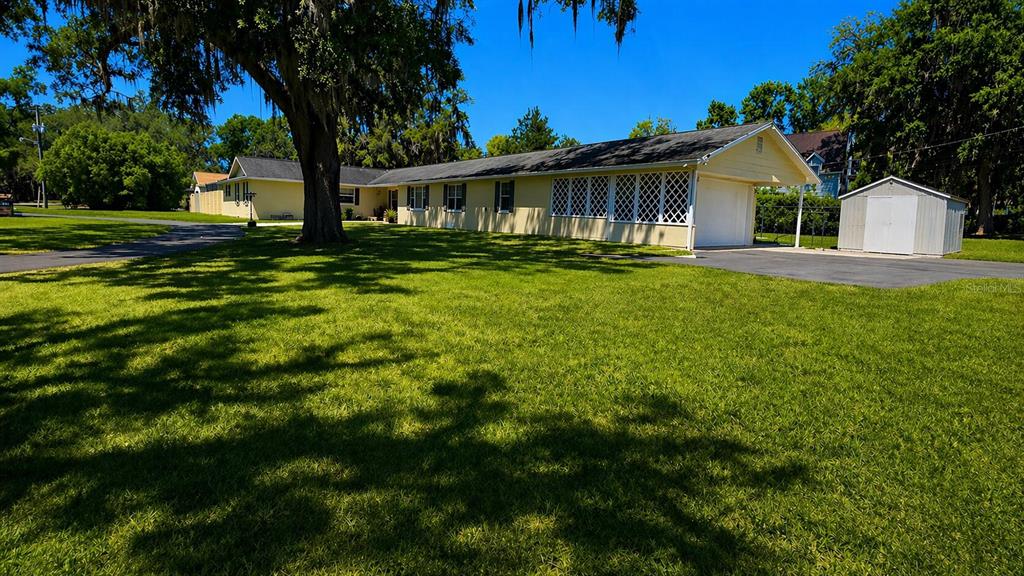2313 Southeast 7th Street Ocala, FL 34471 - Photo 19 of 54 a front view of house with yard and green space