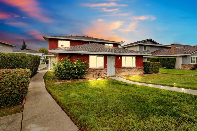 a front view of a house with a yard