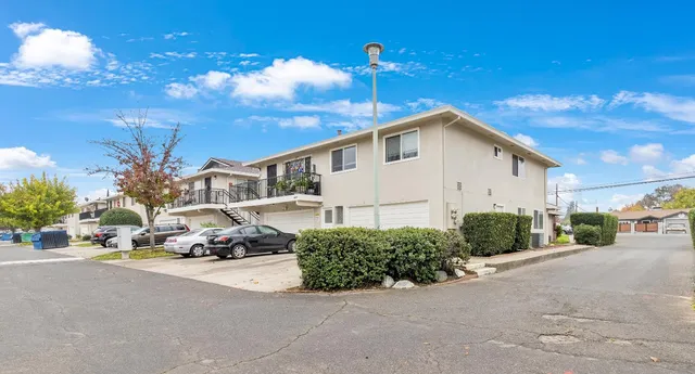 a view of a car park in front of house