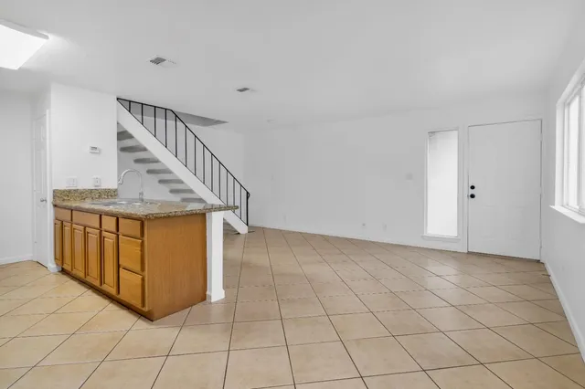 a view of entryway with stairs and wooden floor