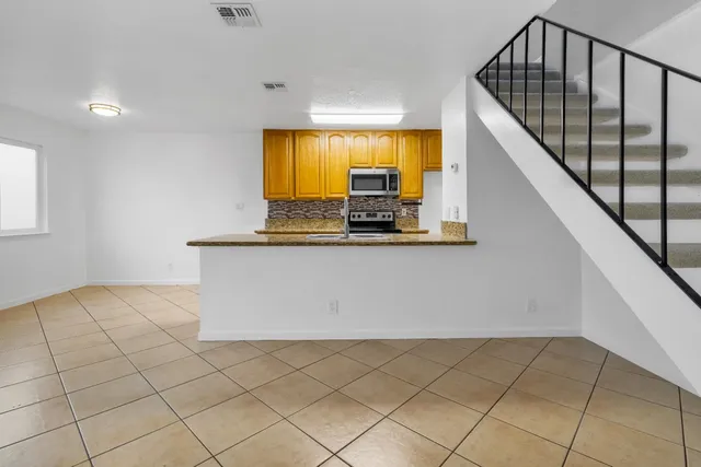 a view of kitchen with furniture and window