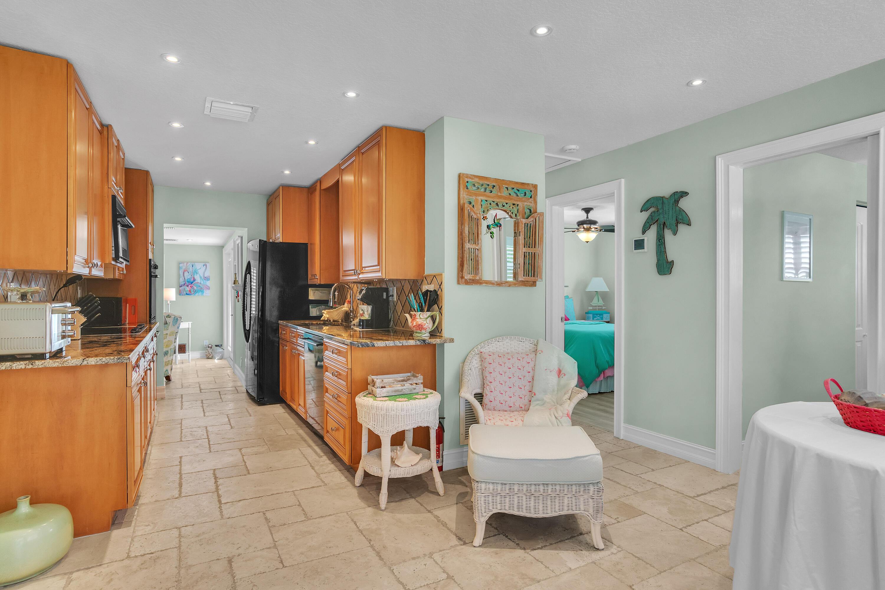 1433 Northeast 27th Street Pompano Beach, FL 33064 - Photo 2 of 17 a living room with furniture and a dining table with kitchen view
