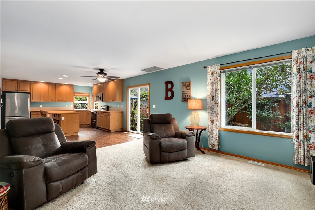 424 170th Place Southeast Bothell, WA 98012 - Photo 14 of 36 a living room with furniture and a large window