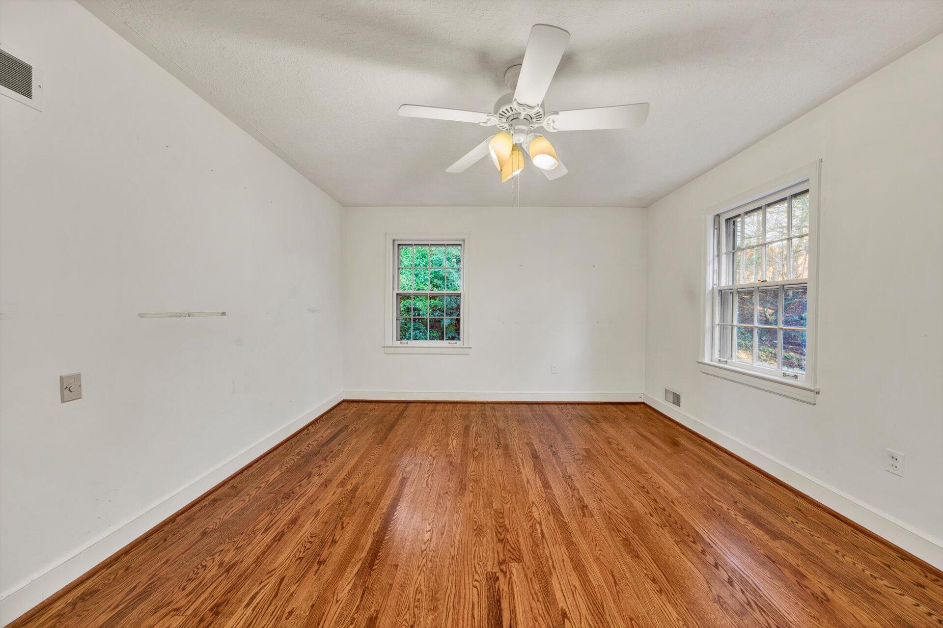 3442 West Ridge Road Southwest Roanoke, VA 24014 - Photo 27 of 42 wooden floor in an empty room with a window