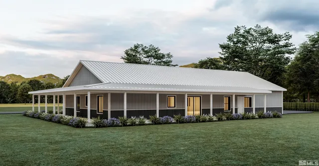 a view of a house with a big yard and large trees