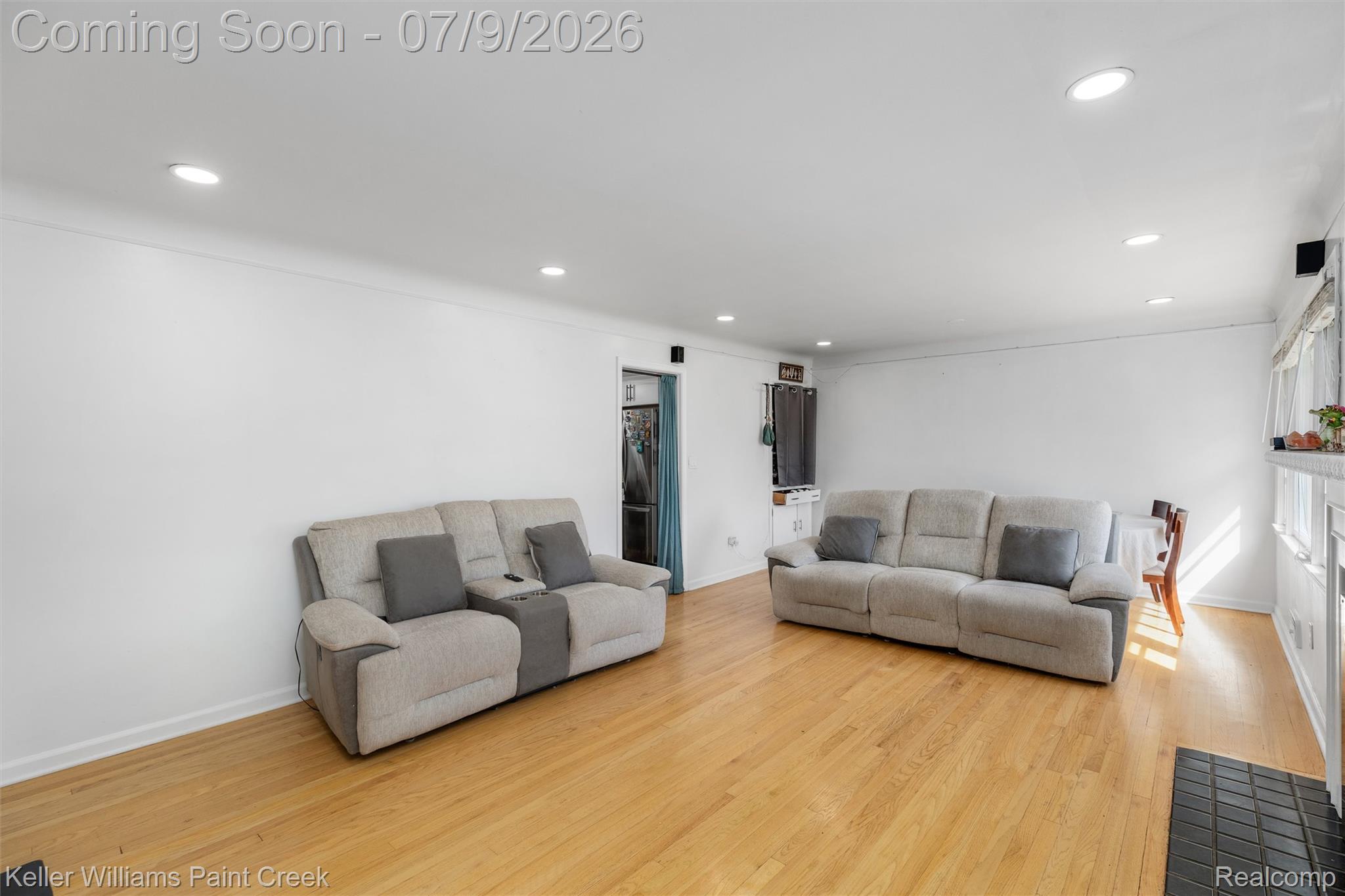 2731 Crooks Road Royal Oak, MI 48073 - Photo 11 of 34 Bright living area featuring wood-finish flooring, recessed lighting, and white baseboards