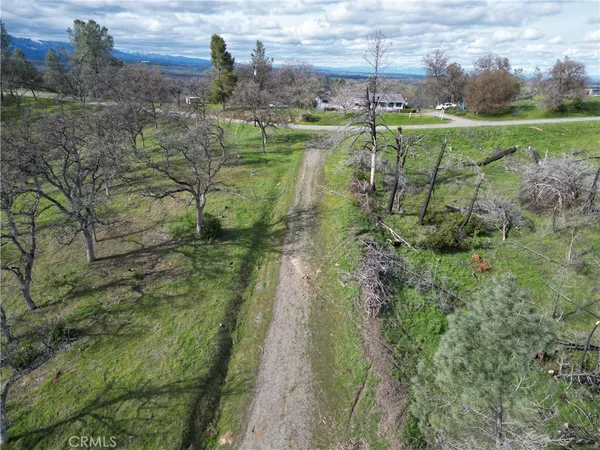 a view of a golf course with a lake view
