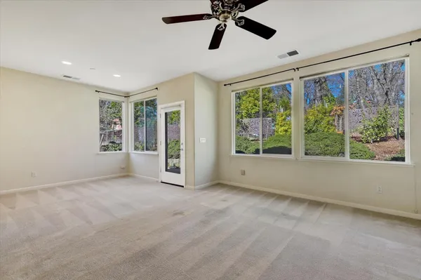 a view of an empty room with a window
