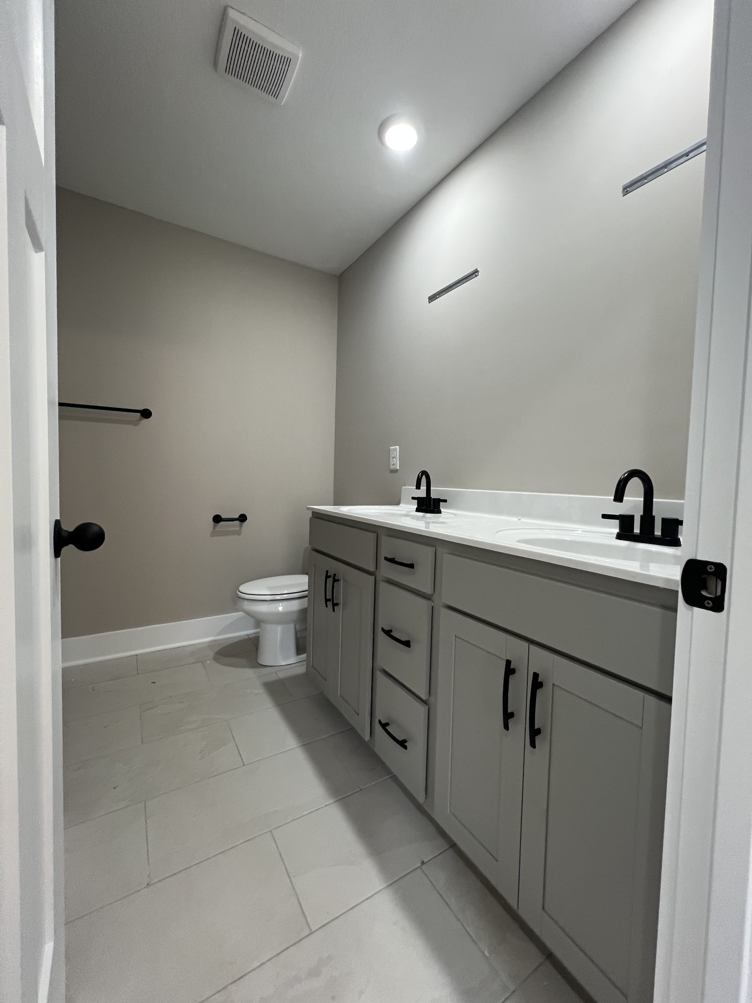280 Cardinal Crk Drive Clarksville, TN 37040 - Photo 12 of 17 a bathroom with a double vanity sink toilet and mirror