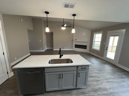 a bathroom with a sink a vanity and a mirror