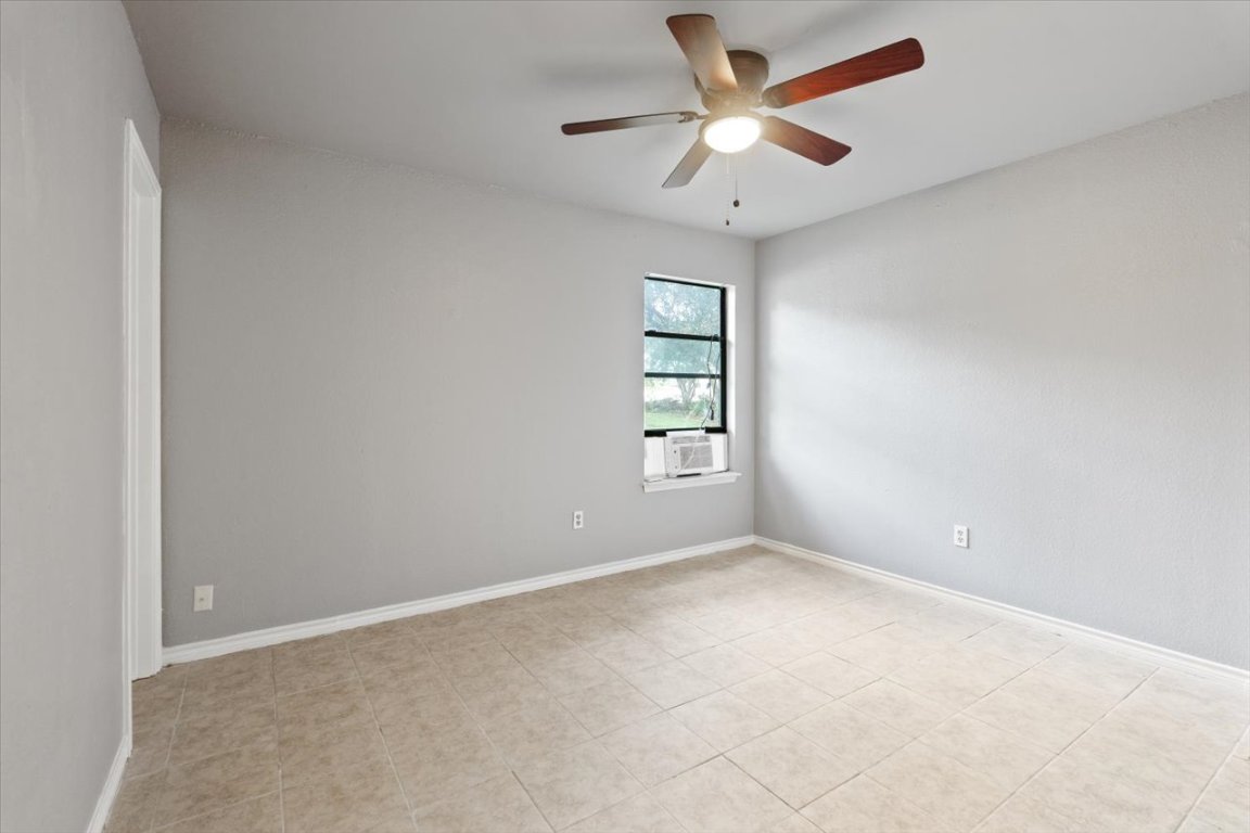 23393 Nameless Road, Unit 156 Leander, TX 78641 - Photo 12 of 21 an empty room with windows and ceiling fan