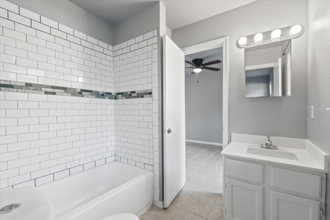 23393 Nameless Road, Unit 156 Leander, TX 78641 - Photo 14 of 21 a bathroom with a bathtub and shower