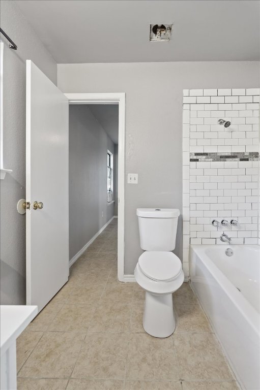 23393 Nameless Road, Unit 156 Leander, TX 78641 - Photo 16 of 21 a white toilet sitting next to a bathroom sink
