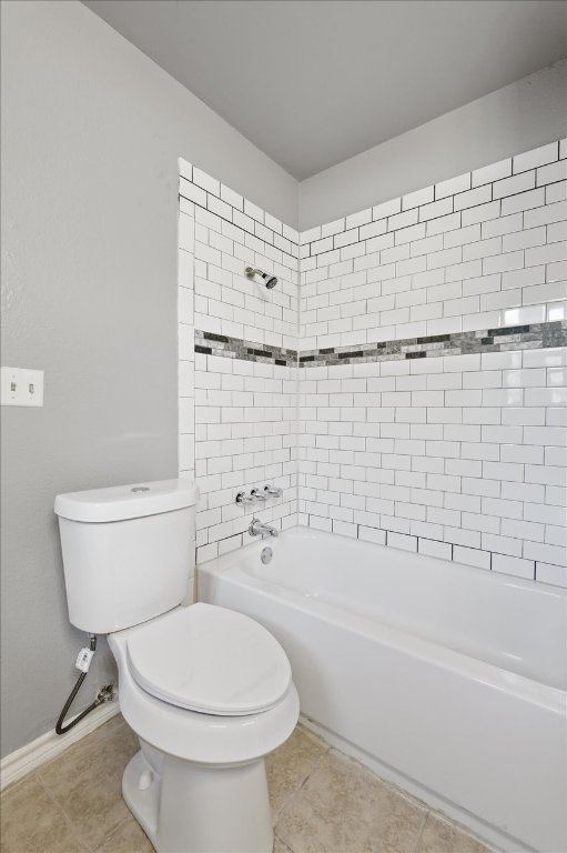 23393 Nameless Road, Unit 156 Leander, TX 78641 - Photo 17 of 21 a bathroom with a toilet and a bath tub