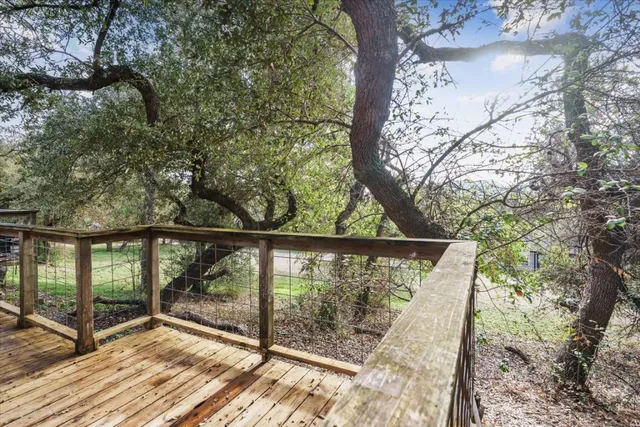 a view of entryway with wooden floor and fence