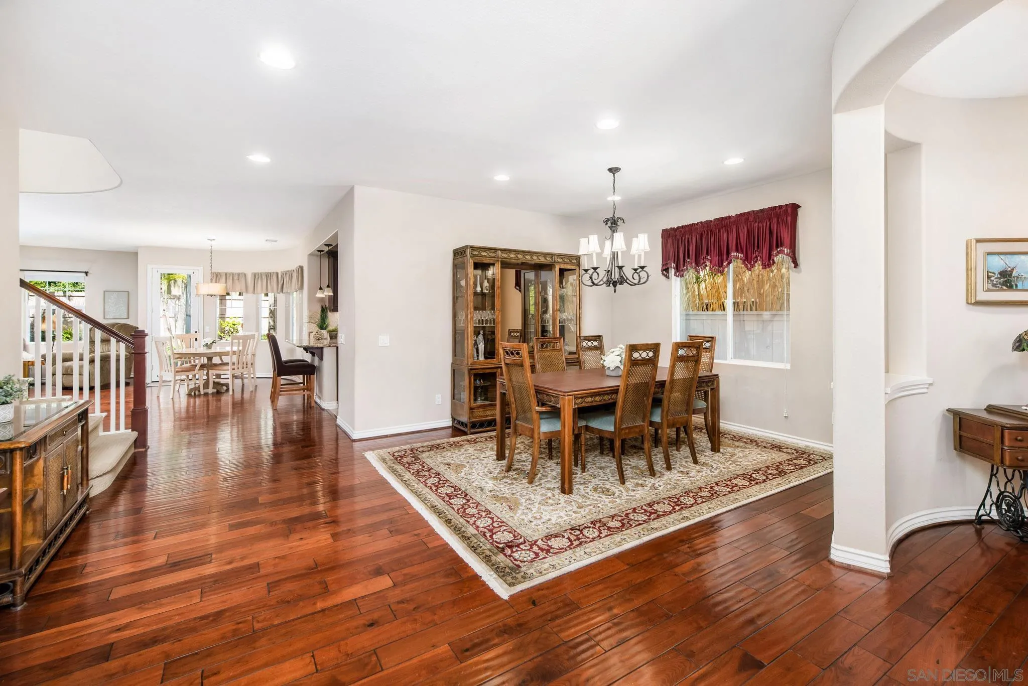 650 Liquid Amber Way San Marcos, CA 92078 - Photo 11 of 48 a view of a dining room with furniture and wooden floor