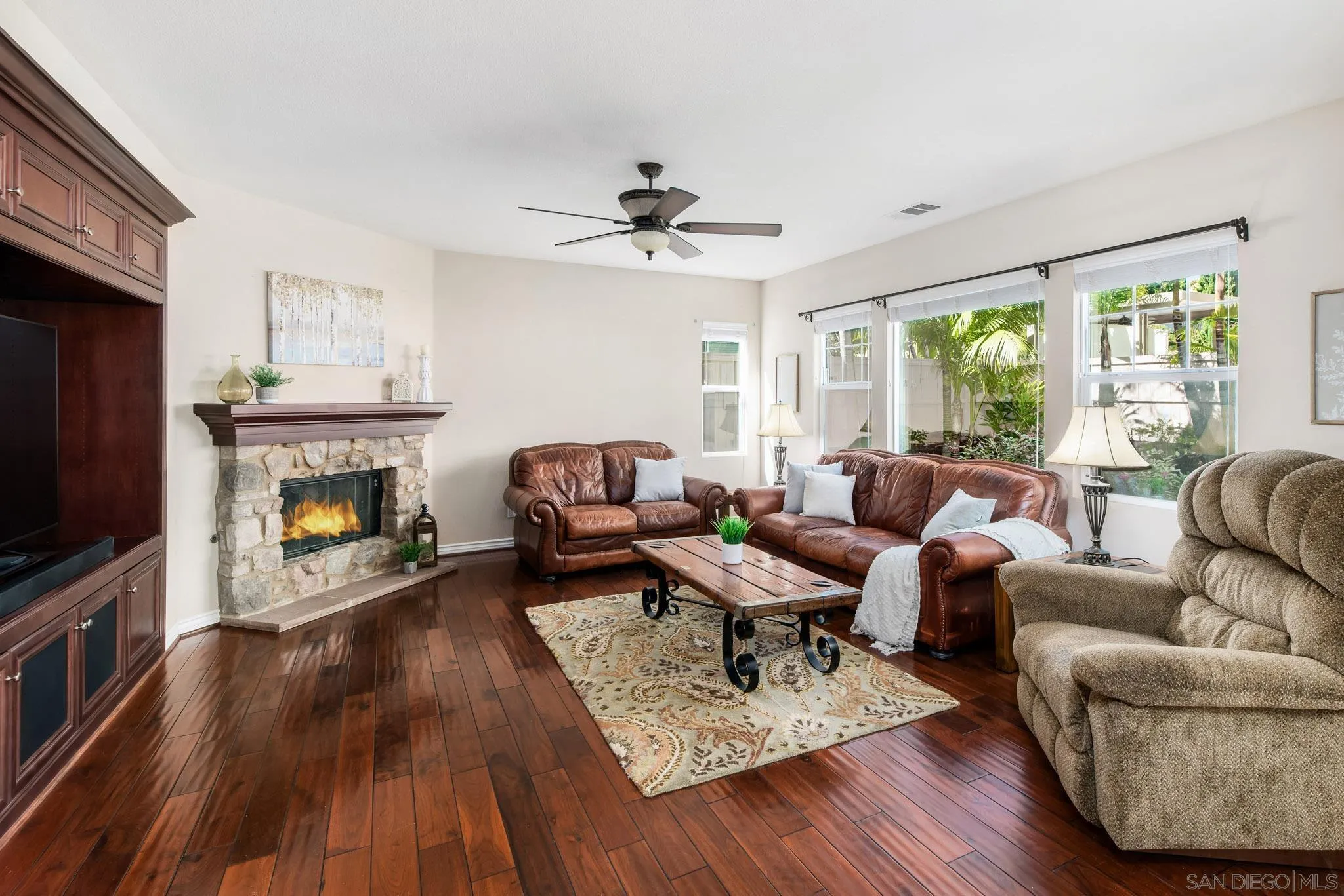 650 Liquid Amber Way San Marcos, CA 92078 - Photo 17 of 48 a living room with furniture and a fireplace