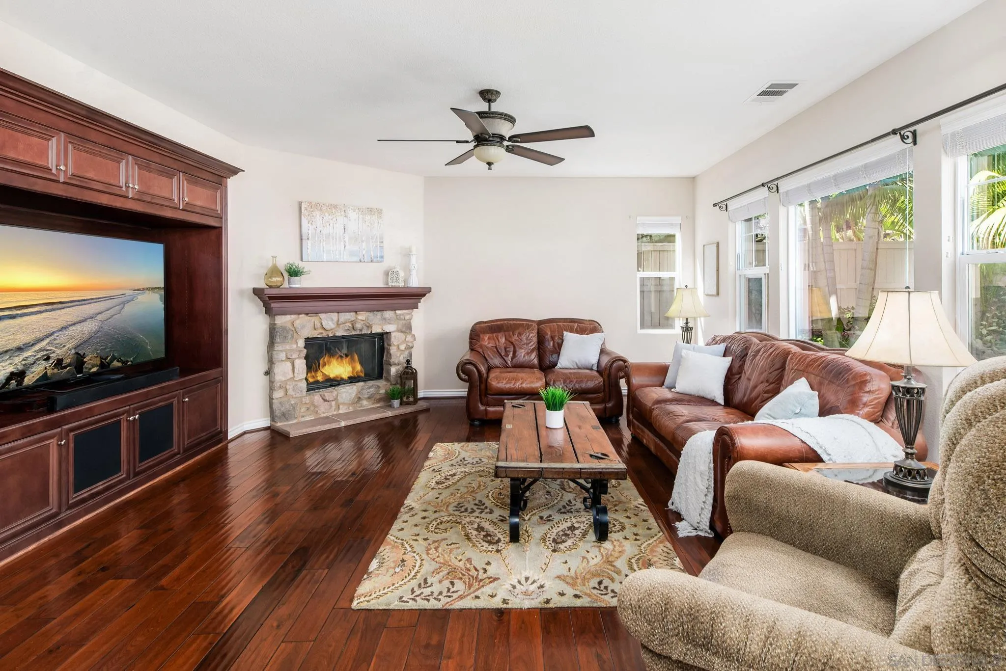 650 Liquid Amber Way San Marcos, CA 92078 - Photo 18 of 48 a living room with furniture and a flat screen tv