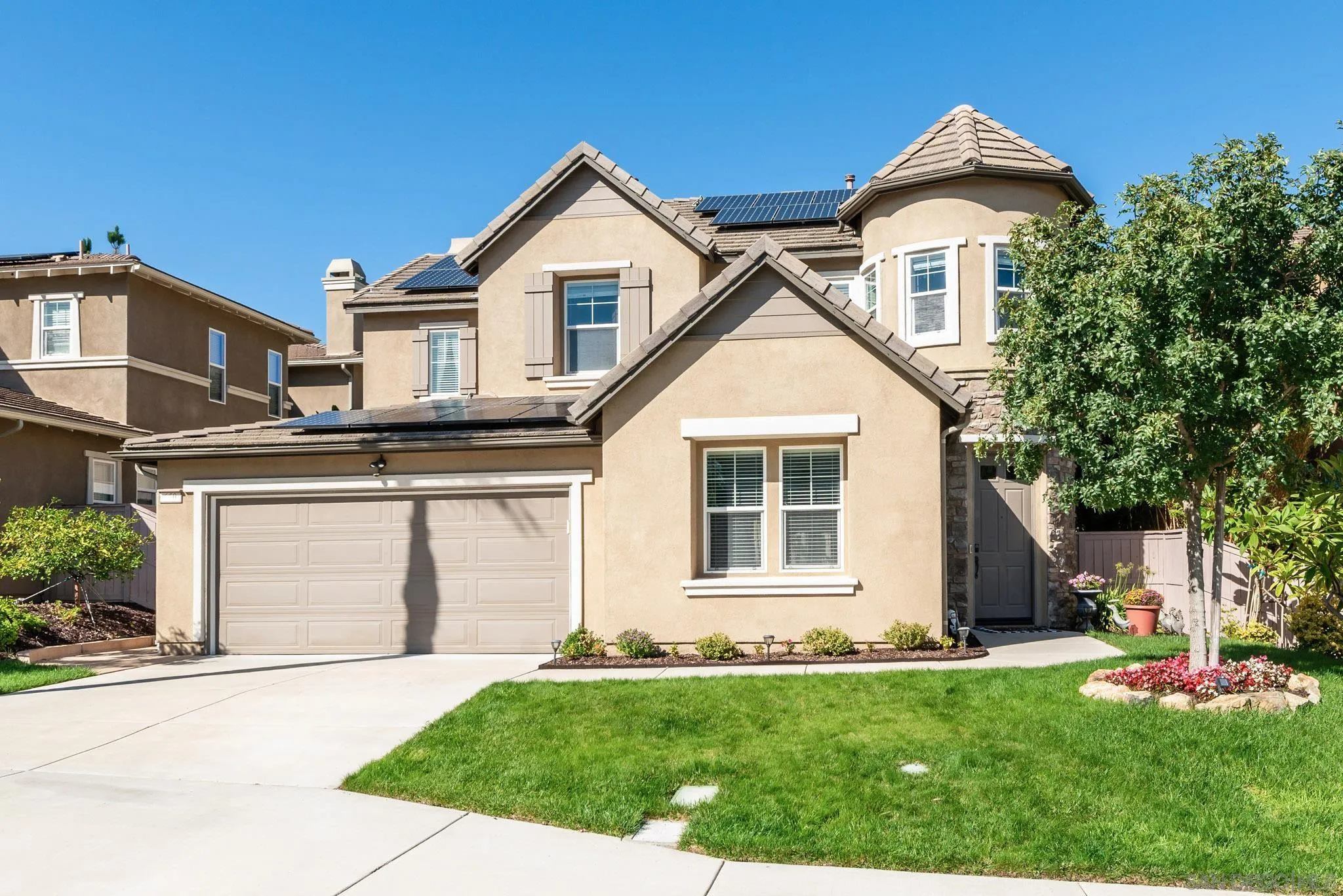 650 Liquid Amber Way San Marcos, CA 92078 - Photo 2 of 48 a front view of a house with a yard