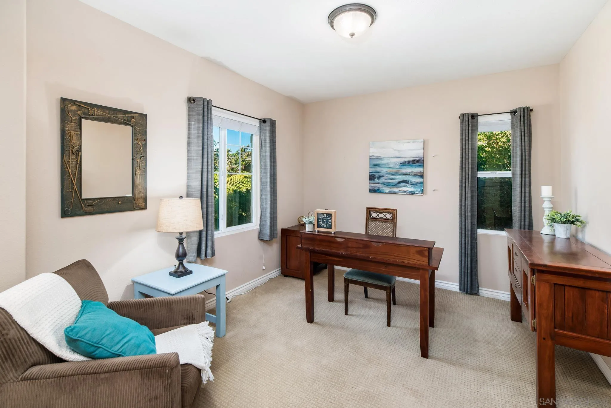 650 Liquid Amber Way San Marcos, CA 92078 - Photo 25 of 48 a view of a livingroom with furniture and a potted plant
