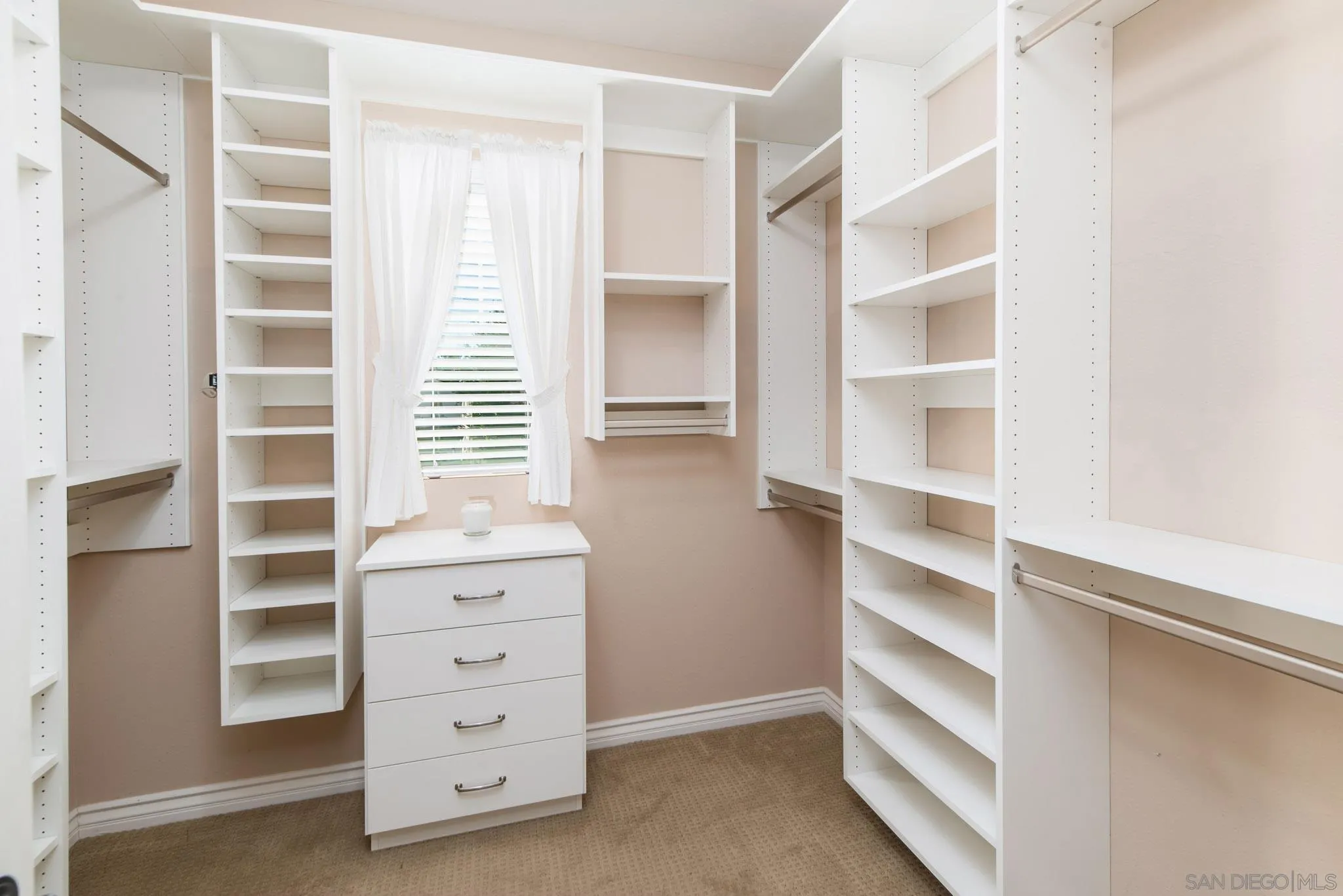650 Liquid Amber Way San Marcos, CA 92078 - Photo 32 of 48 a view of walk in closet with clothes and shoes