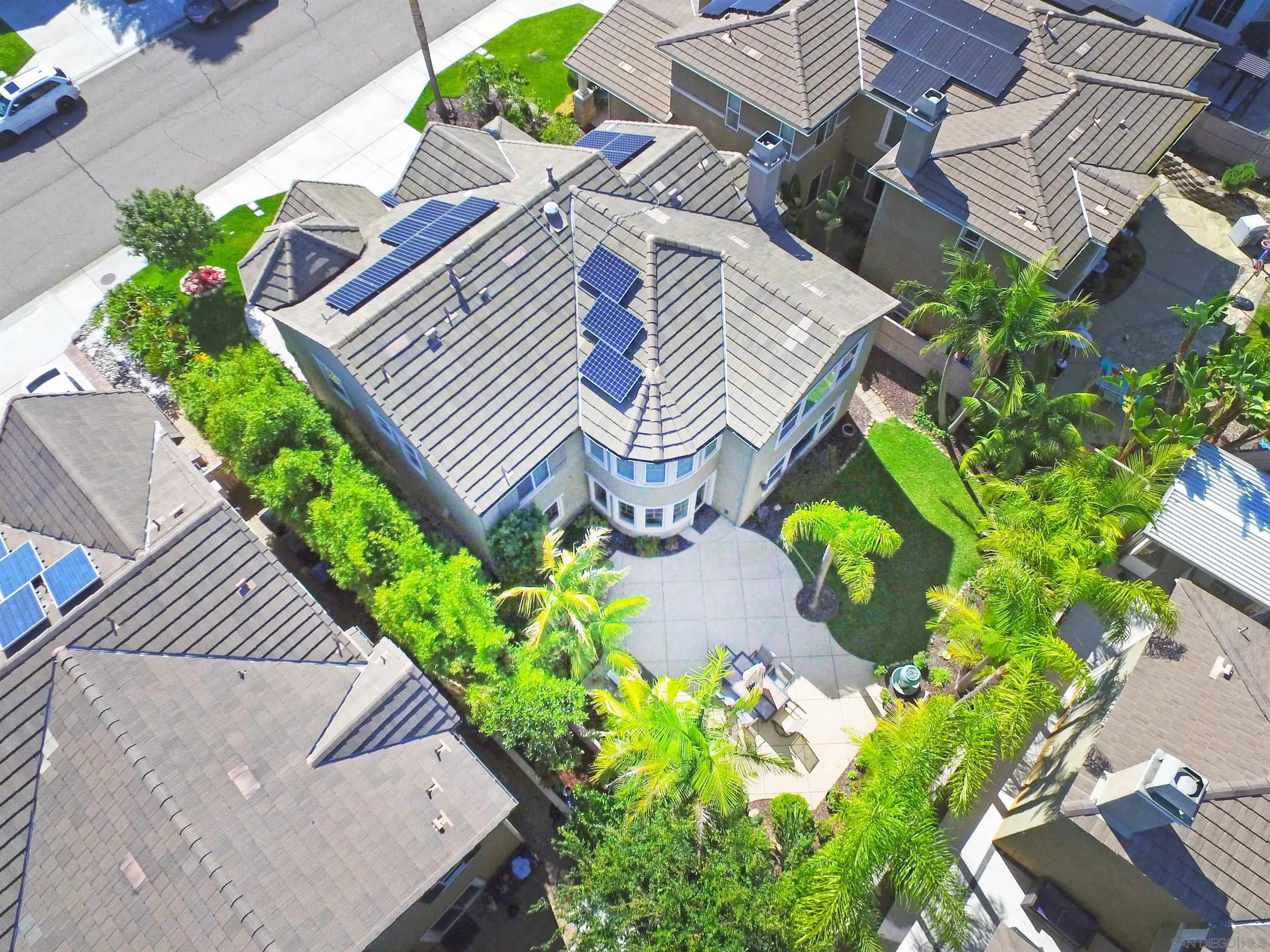 650 Liquid Amber Way San Marcos, CA 92078 - Photo 46 of 48 an aerial view of a house with a yard and flowers