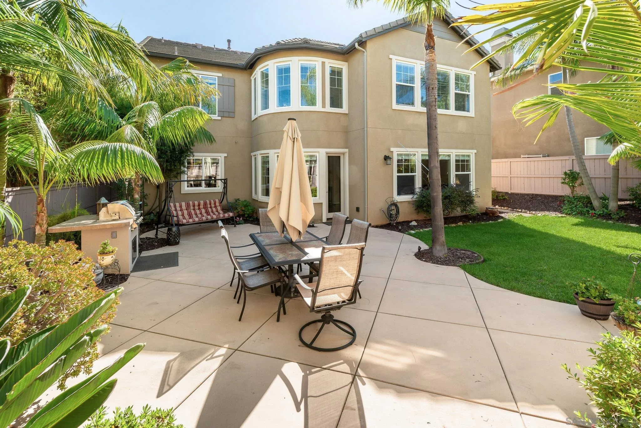 650 Liquid Amber Way San Marcos, CA 92078 - Photo 5 of 48 a view of backyard with outdoor seating and plants