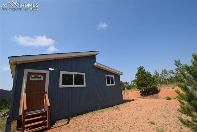 80 Spur Road Divide, CO 80814 - Photo 2 of 48 View of outdoor structure featuring entry steps