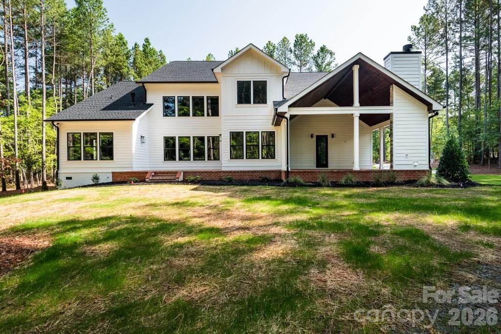 116 Silver Falls Road Troutman, NC 28166 - Photo 43 of 46 a front view of a house with a yard