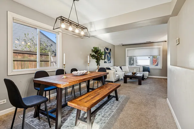 a reading room with furniture wooden floor and a window