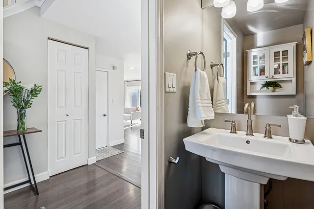 a bathroom with a sink and a mirror