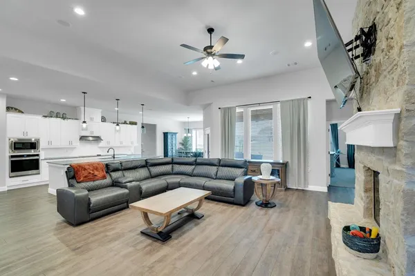 a living room with furniture and a fireplace
