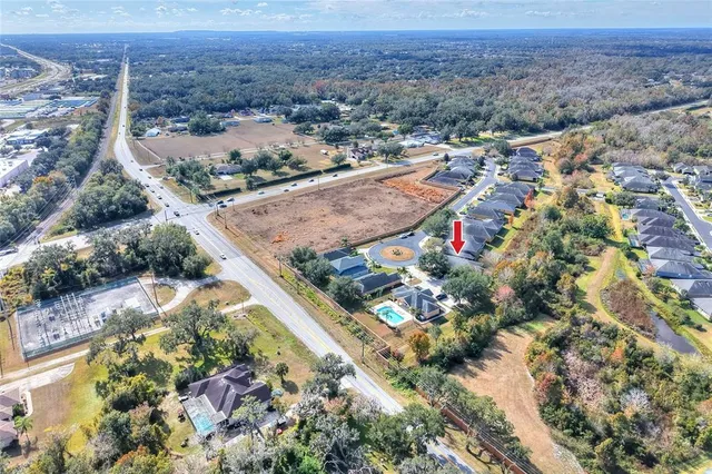 an aerial view of residential houses with outdoor space