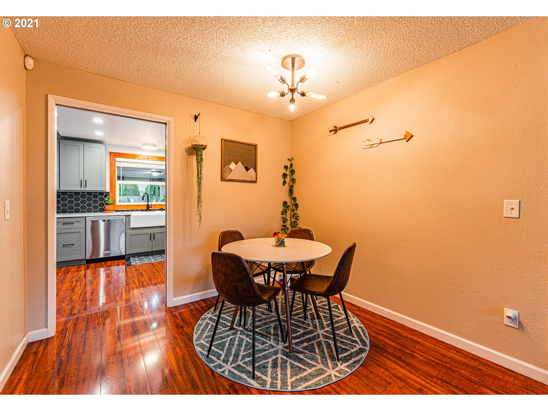 5649 E Street Springfield, OR 97478 - Photo 14 of 19 a dining room with furniture and chandelier