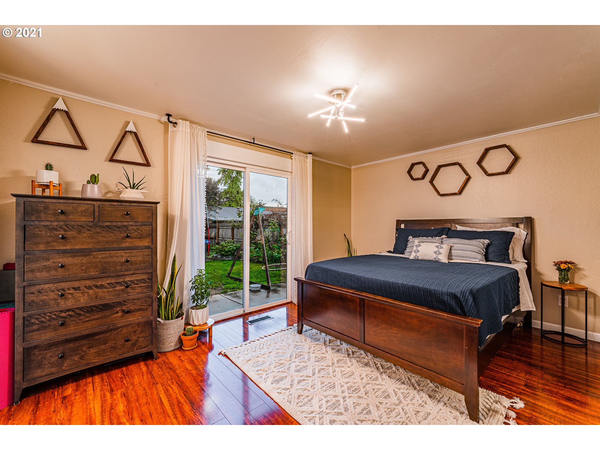 5649 E Street Springfield, OR 97478 - Photo 15 of 19 a living room with furniture and a floor to ceiling window