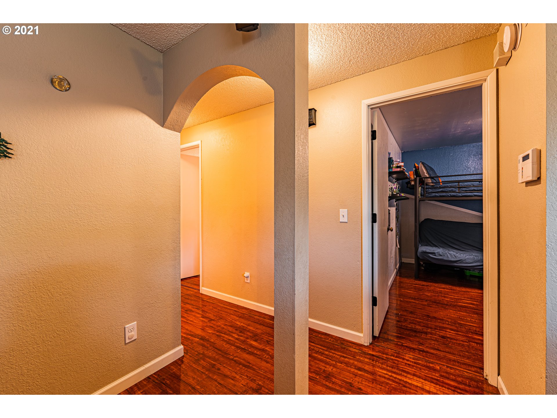 5649 E Street Springfield, OR 97478 - Photo 18 of 19 a view of a hallway with wooden floor