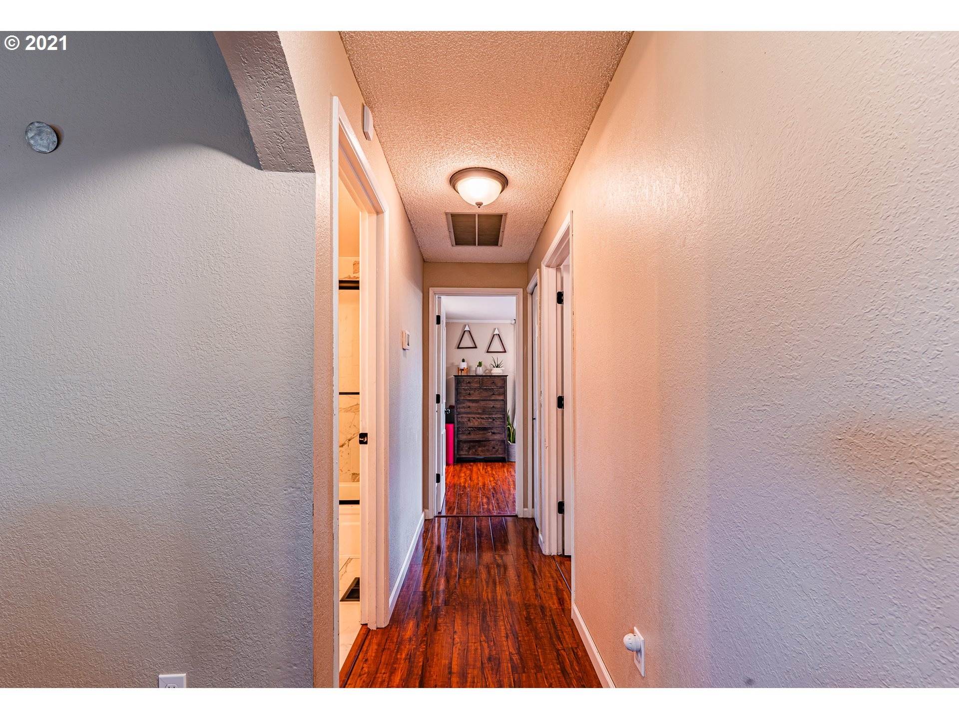 5649 E Street Springfield, OR 97478 - Photo 19 of 19 a view of a hallway with wooden floor