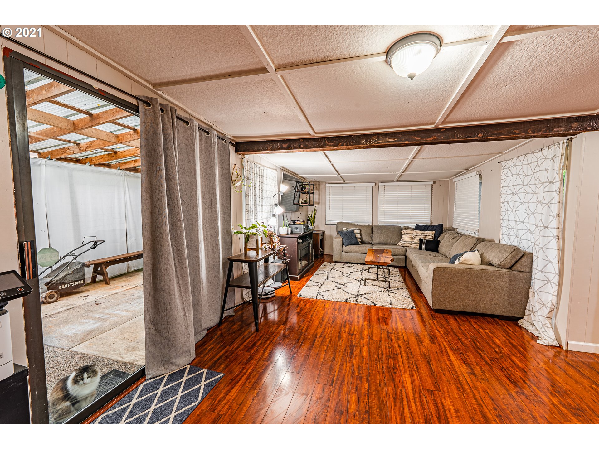 5649 E Street Springfield, OR 97478 - Photo 6 of 19 a living room with furniture wooden floor and a large window