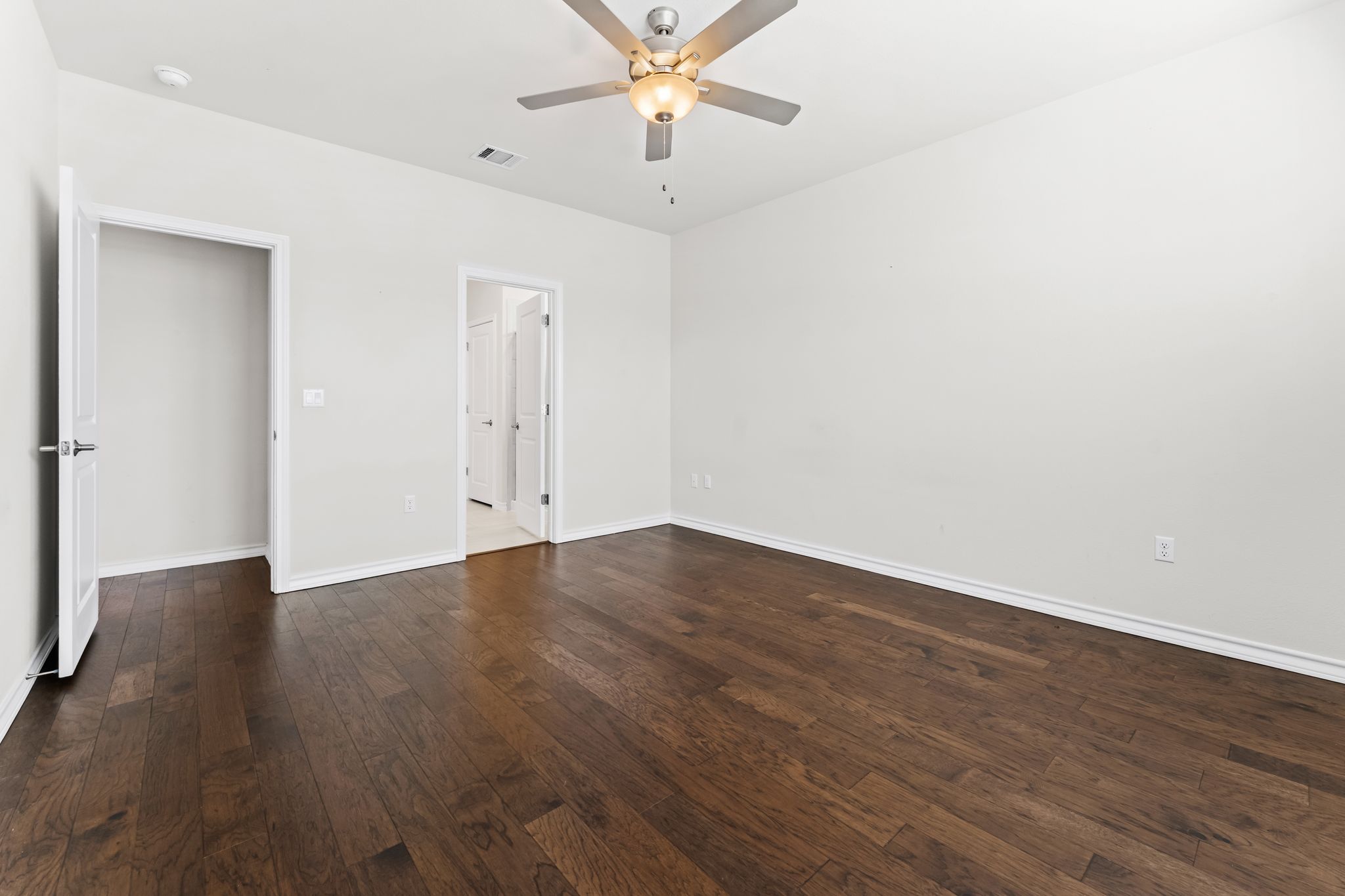 2803 Mary Elizabeth Drive Austin, TX 78728 - Photo 11 of 30 Unfurnished bedroom with dark wood finished floors and ceiling fan