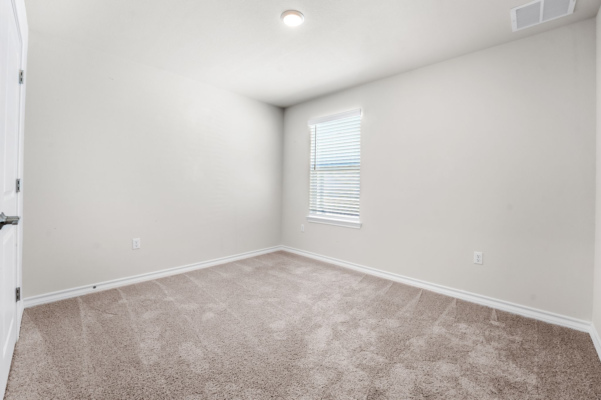 2803 Mary Elizabeth Drive Austin, TX 78728 - Photo 23 of 30 Empty room featuring baseboards and light carpet
