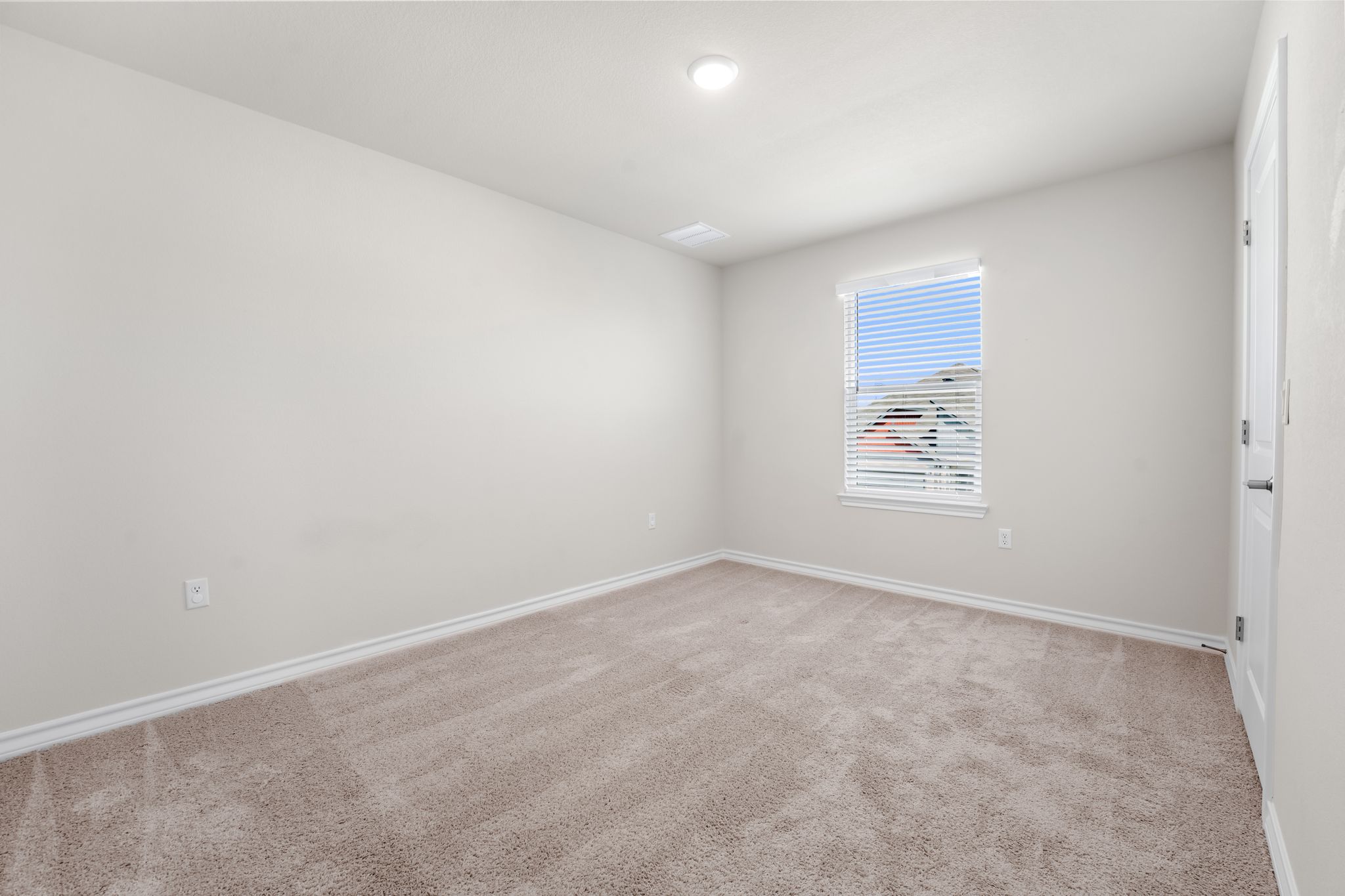 2803 Mary Elizabeth Drive Austin, TX 78728 - Photo 24 of 30 Spare room featuring baseboards and light carpet