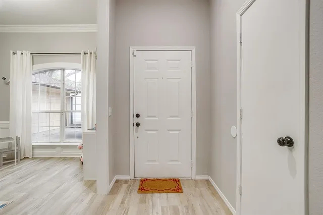 a view of room with hardwood floor and window