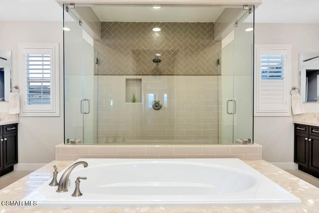 7307 Nicklaus Road Moorpark, CA 93021 - Photo 48 of 96 a bathroom with a bathtub and a shower