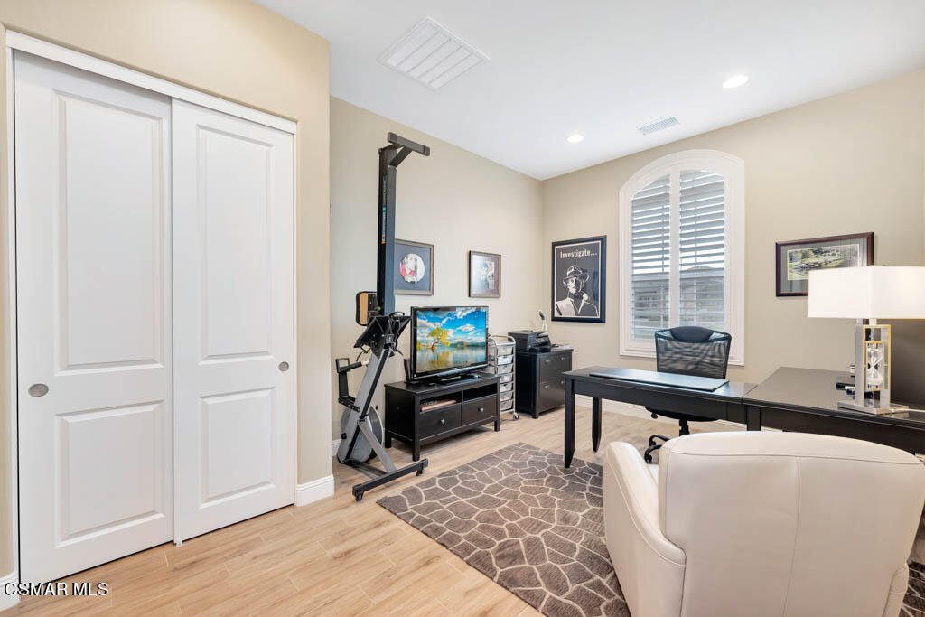 7307 Nicklaus Road Moorpark, CA 93021 - Photo 49 of 96 a living room with furniture a window and a flat screen tv