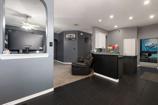 a kitchen with a sink dishwasher stove and refrigerator