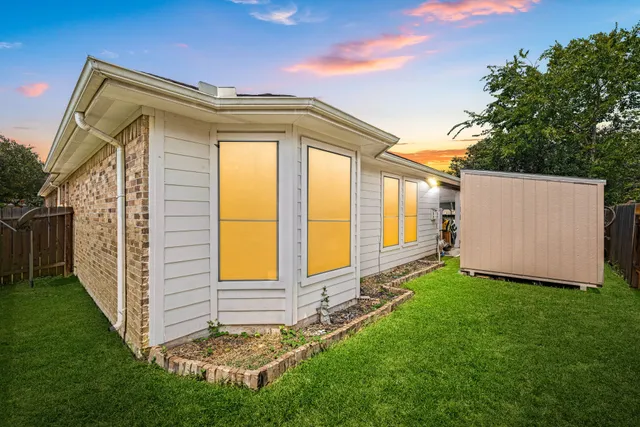 a view of a back yard of the house