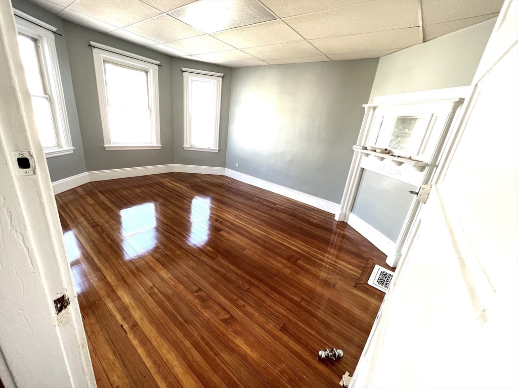 6 Taft Street, Unit 1 Boston, MA 02125 - Photo 3 of 10 a view of balcony with wooden floor