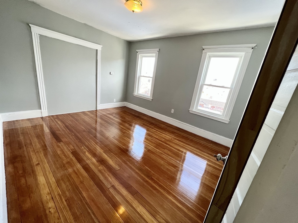 6 Taft Street, Unit 1 Boston, MA 02125 - Photo 4 of 10 a view of an empty room and window