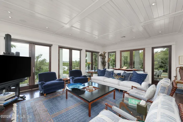 a view of a lake with houses in back